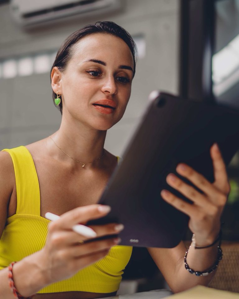 A marketer reading an AI visibility report on a tablet